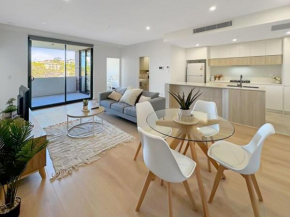 Modern 2BR Suite with Balcony & Parking near Airport